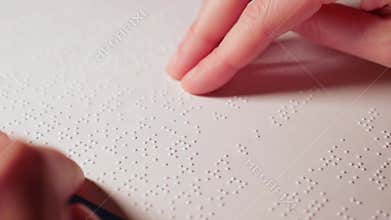Woman reading Braille text