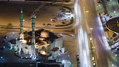 Cityscape of Ajman from rooftop night aerial timelapse