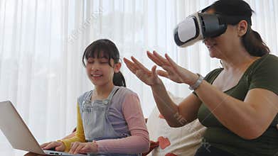 Granddaughter guide grandmother to dive in metaverse with VR. Divergence.