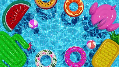 Loop inflatable circles ball mattress floating in the pool in summer top view