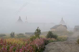 Solovetsky Monastery hiding under the haze of morning fog