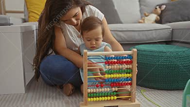 Mother teaching daughter with an abacus in a cozy living room, showcasing family love and interaction