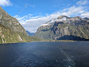 Clouds around the mountains of Milford Sound