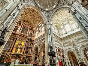 wide angle panorama of the cathedral inside the mosque in cordova, spain