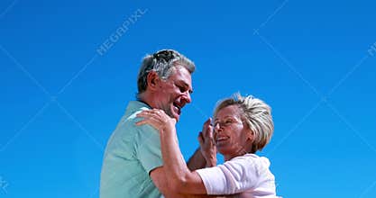 Active seniors dancing together and smiling