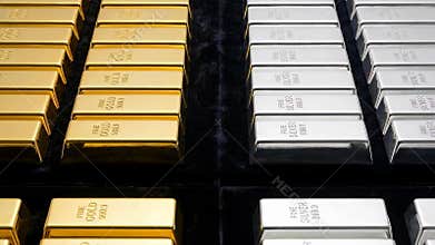 Gold and silver bullion stacked in a vault for investment and financial storage.