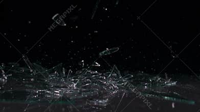 Glass falling and smashing into pieces