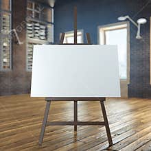 Easel with empty canvas in interior