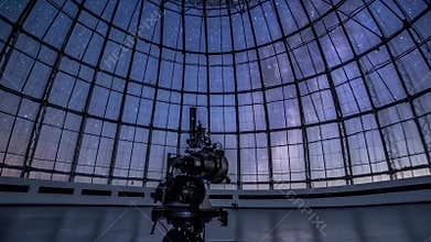 Planetarium projector under a vast glass dome, showcasing celestial projections and astronomical wonders