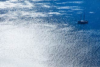 Sailing boat in silvery blue sea in Rio de Janeiro