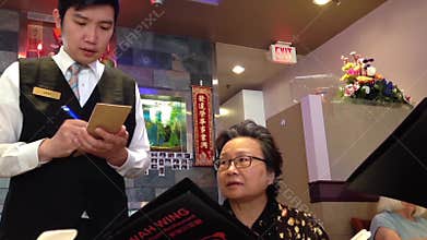 People ordering food inside Chinese restaurant