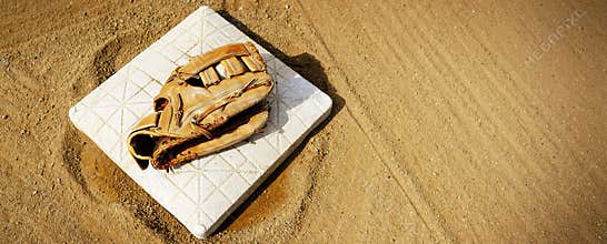 Leather Baseball Mit or Ball Glove on Base on Diamond or Field f