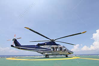 Helicopter parking landing on offshore platform. Helicopter transfer crews or passenger to work in offshore oil and gas industry