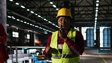 Black female engineer, walkie-talkie, production line, industry plant