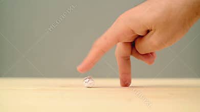 Soccer player kicking a ball and walking out. Finger walk hand gesture.