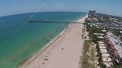 Sandy Florida beach and pier aerial view