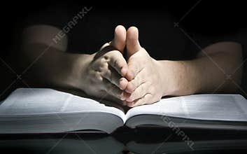 Praying man and bible