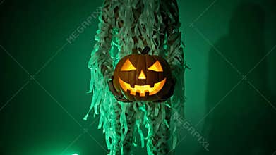Creepy Creature Holds Glowing Jack-o\'-lantern in Dark Green Halloween Night