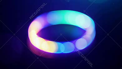 Colorful Light Ring Rotating Slowly In Dark Room At Night