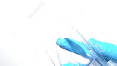 The surgeon is putting a breathing mask on the patient's face. After administering anesthesia