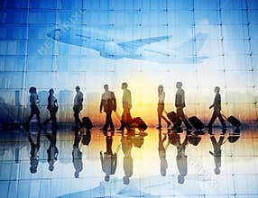 Group of Business Travelers Walking in an Airport
