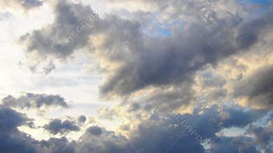 Enjoy the stunning display of vibrant clouds as the sun sets over the ocean. The sky transforms with shades of orange, pink, and