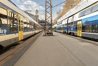 MÁV-Start Trains and Historic Clock Tower at Budapest Nyugati Railway Station