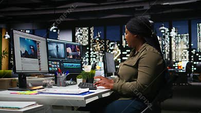 African american female videographer editing a film montage project