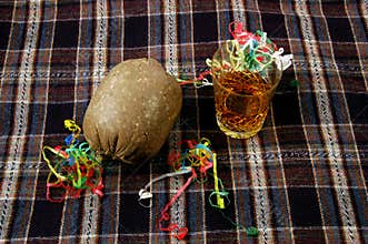 Burns Night. Haggis with nip of Whisky on a Tartan.