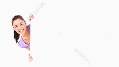 Smiling brunette showing a copy space