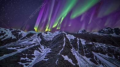 snowy mountain ridges under aurora lights rugged alpine valleys and striated snow tracks lead toward jagged peaks