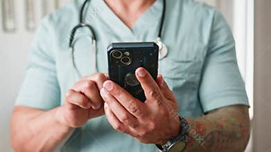 Healthcare Worker In Scrubs Using Smartphone For Modern Digital Medical Communication And Appointment Management