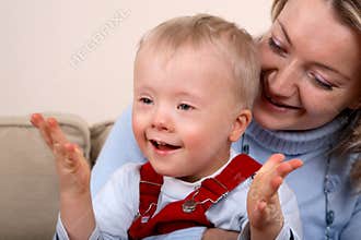 Mother hold handicapped boy