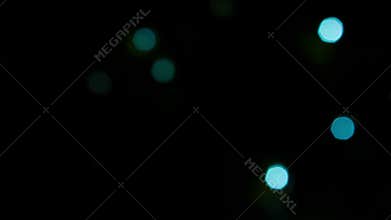 Sparkling blue lights on a black background