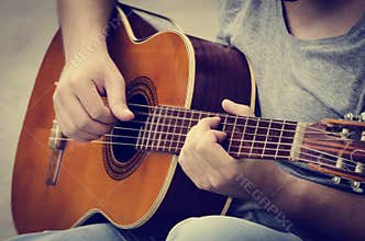 Man plays the guitar
