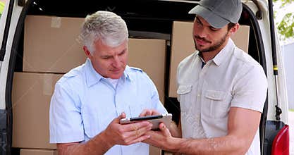 Delivery driver using tablet to take customers signature