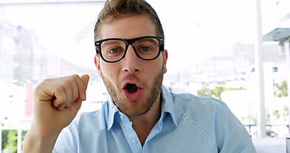 Handsome businesswoman talking to camera