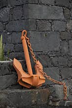Old orange ship anchor