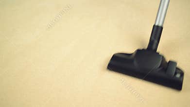 Vacuum Cleaner sweeping Brand New Carpet. Housework and home hygiene