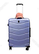 closed wheeled hardshell suitcase in blue and purple tones. Pink baseball cap on top highlights