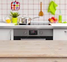 Wooden table on blurred kitchen bench background