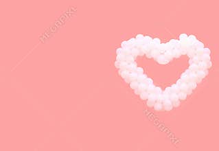 White balloons in the form of heart on a pink background