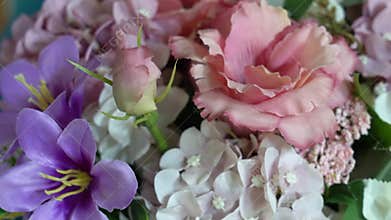 Bright flowers arranged in a beautiful bunch on a table with simple details in a cheerful setting