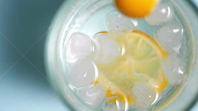 Lemonade with lemon slices and ice in a glass