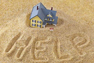 House sinking in quick sand with for rent sign and word help written in sand