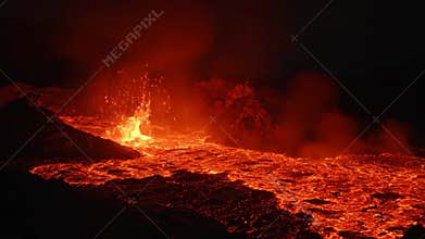 Hot Lava Flowing From Volcano During Night Eruption At Iceland