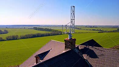Antenna tower installed on roof of countryside house, modern communication infrastructure connecting rural area. AI generated
