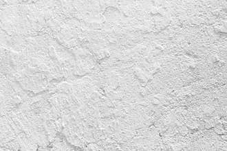 Closeup grunge texture white paint cement wall.