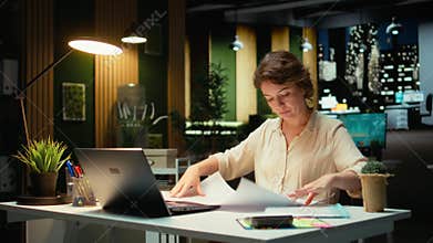 Project manager fixing targets and agenda after hours for evolution