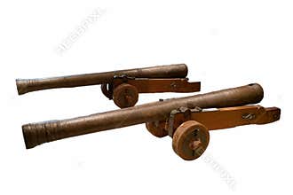 Two vintage cannons displayed together emphasize historical military craftsmanship in a simple setting